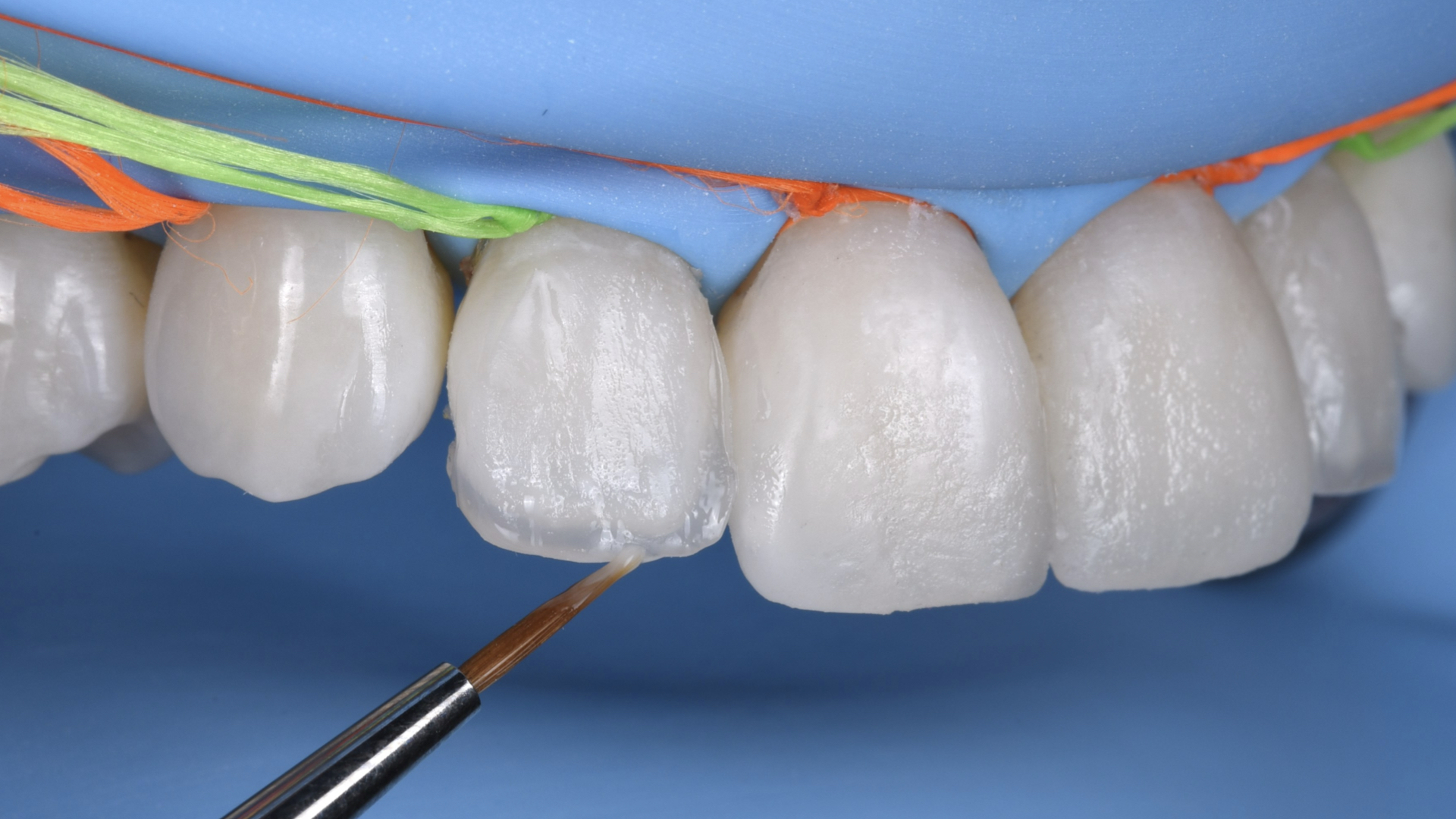 Composite layering with a brush under isolation